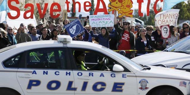 Aug. 31: People protesting against Shell Oil greet President Obama's motorcade as he arrives to deliver remarks to the GLACIER Conference in Anchorage, Alaska.