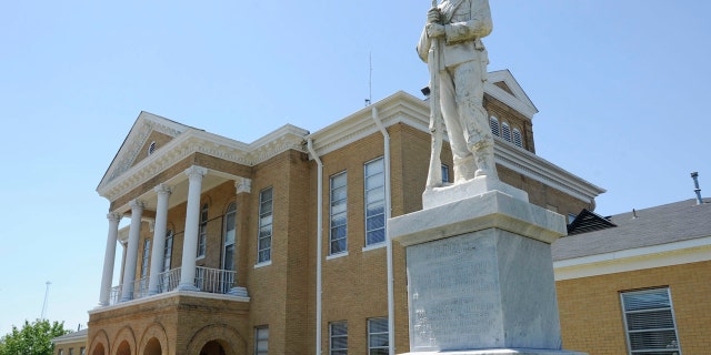 In this April 10, 2014, file photo, a Confederate monument stands outside the Choctaw County Courthouse in Butler, Ala.