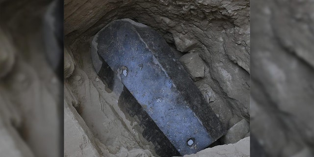 The sarcophagus lid and body have been sealed with mortar, which may indicate that it has not been opened since it was closed more than 2,000 years ago. (Egyptian Ministry of Antiquities)
