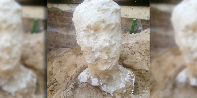 The carved alabaster head discovered at the site. (Egyptian Ministry of Antiquities)