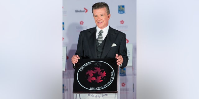 Actor Alan Thicke stands by his star during Canada's Walk of Fame induction ceremonies in Toronto, September 21, 2013.  REUTERS/Mark Blinch     (CANADA - Tags: ENTERTAINMENT) - RTX13TYB