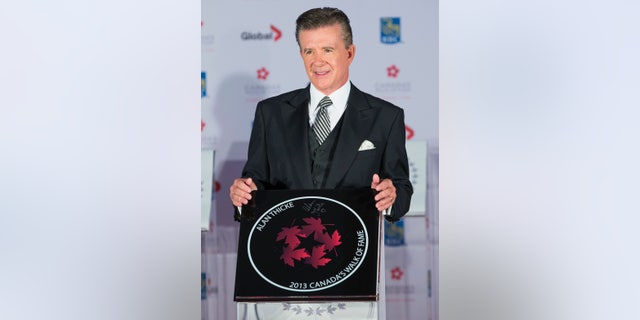 Actor Alan Thicke stands by his star during Canada's Walk of Fame induction ceremonies in Toronto, September 21, 2013. REUTERS/Mark Blinch (CANADA - Tags: ENTERTAINMENT) - RTX13TYB