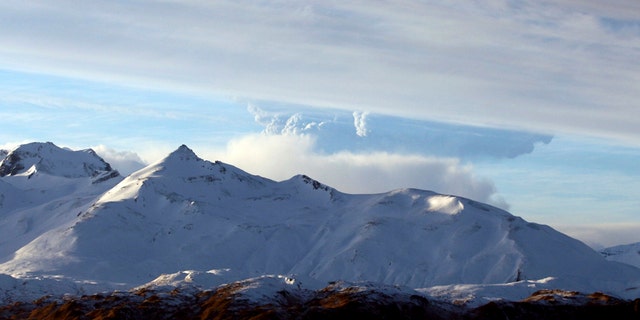 This photo taken Dec. 21, 2016 and provided by Lynda Lybeck Robinson shows the Bogoslof Volcano erupting in the Aleutian Islands, Alaska. The active Alaska volcano, which has erupted 10 times since mid-December and is located about 850 miles southwest of Anchorage, erupted again Thursday, Jan. 5, 2017, this time sending a cloud of ash and ice 35,000 feet in the air. (Lynda Lybeck Robinson via AP)