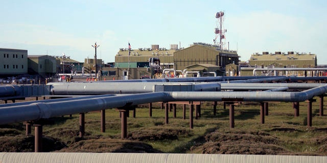 Shown here are oil and gas pipelines running into Alyeska's trans-Alaska oil pipeline pump station in Deadhorse, Alaska.