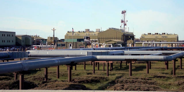 Shown here are oil and gas pipelines running into Alyeska's trans-Alaska oil pipeline pump station in Deadhorse, Alaska.
