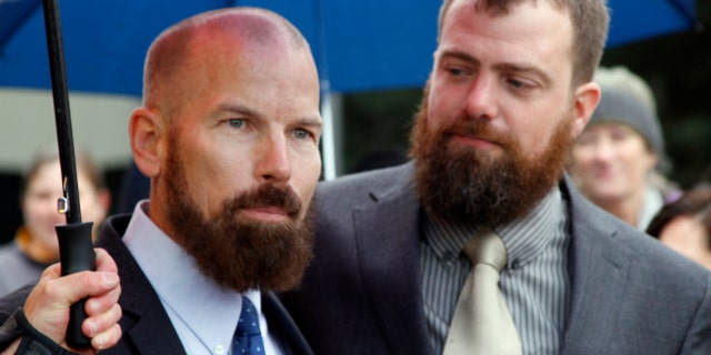 Oct. 10, 2014: Matthew Hamby, left, and Christopher Shelden speak during a news conference following a hearing.