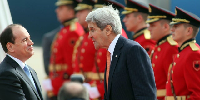 Feb. 14, 2016: U.S Secretary of State John Kerry, right, meets with host Albanian President Bujar Nishani after landing at the International Airport Mother Teresa, Tirana.