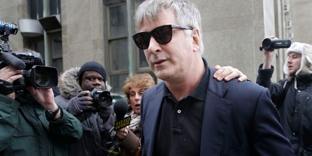 Nov. 12, 2013: Actor Alec Baldwin leaves criminal court in New York.