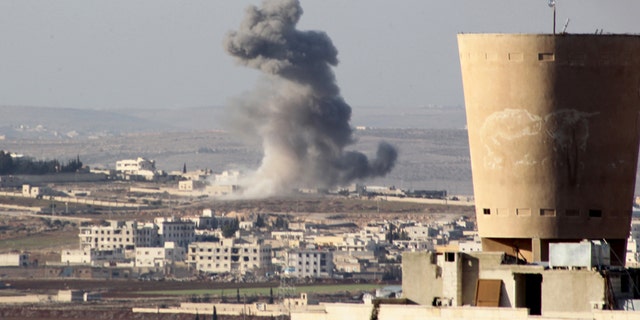 Feb. 3, 2016: Smoke rises after airstrikes by pro-Syrian government forces in Anadan city, about 10 kilometers away from the towns of Nubul and Zahraa, Northern Aleppo countryside, Syria.
