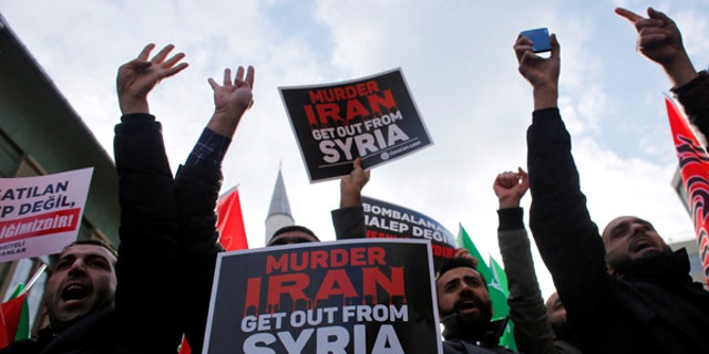 Demonstrators shout slogans during a protest against Iran's role in Aleppo, near the Iranian Consulate in Istanbul, Turkey, December 16, 2016.