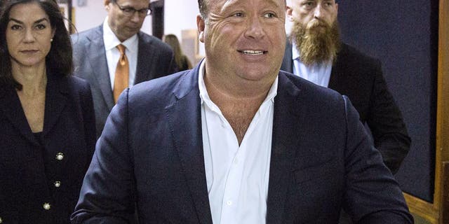 In this April 17, 2017, file photo, "Infowars" host Alex Jones arrives at the Travis County Courthouse in Austin, Texas.
