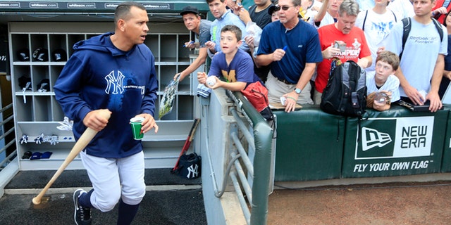 Aug. 7, 2013: New York Yankees' Alex Rodriguez heads to a batting cage before a baseball game against the Chicago White Sox in Chicago.