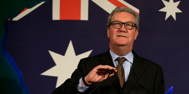 This June 22, 2015, file photo shows Australian High Commissioner Alexander Downer speaking to guests during a welcome party at the Australian High Commission in London.