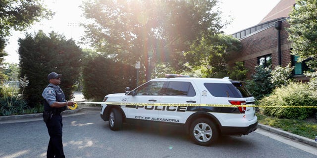 An Alexandria, Va. police officer tapes off an area near the YMCA after a shooting in Alexandria, Va. Wednesday, June 14, 2017. House Majority Whip Steve Scalise of La. was shot at a Congressional baseball practice. (AP Photo/Alex Brandon)