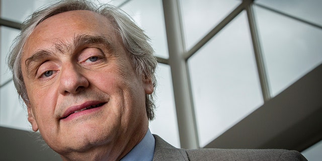 In this July 24, 2014, file photo, then-Chief Judge of the U.S. Court of Appeals for the Ninth Circuit Alex Kozinski poses for a portrait in the lobby of a Washington office building.
