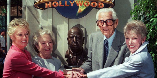 Actress Tippi Hedren (L) is joined by Pat Hitchcok O'Connell, daughter of the late Alfred Hitchcock, Lew Wasserman, Chairman and Emeritus of Universal Studios Inc., and actress Janet Leigh (R) July 27 at Universal Studios in Los Angeles during ceremonies dedicating a permanent monument to the late Alfred Hitchcock for the filmmakers August 13, centennial birthday. Leigh starred in Hitchock's " Pyscho" and Hedren was in his film " The Birds." - RTXJ45O