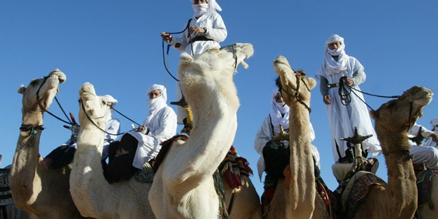 In this Dec. 12, 2002 file photo Tuaregs are shown on their camels outside Ghardaia, southern Algeria. The awe-inspiring dunes and wild mountains of Algerias Sahara have lured adventure travelers for decades, but their latest incarnation -- as a crossroad for the Al Qaeda militants who attacked a natural gas complex -- is likely to make them even more inaccessible.