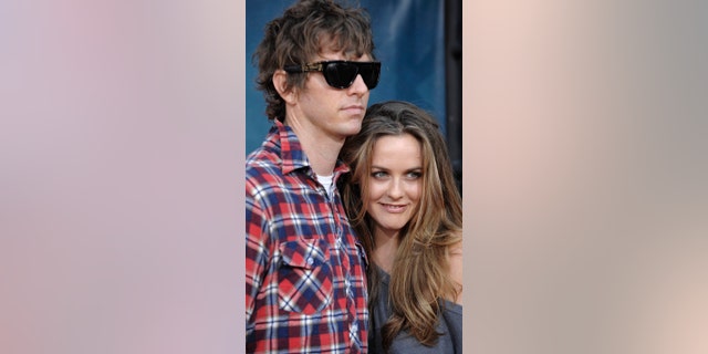 FILE - In this Thursday July 31, 2008 file photo, Christopher Jarecki and Alicia Silverstone arrive at the premiere of "Pineapple Express" in Mann Village Theater in Los Angeles. Alicia Silverstone is divorcing her husband of nearly 13 years. The "Clueless" actress filed for divorce from Christopher Jarecki on Friday, May 25, 2018 in Los Angeles County Superior Court