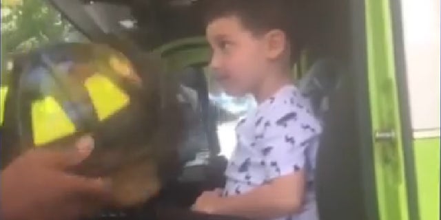 The boy got to meet firefighters after helping to save his family.