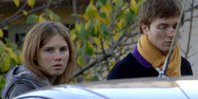 In this Friday Nov. 2, 2007 file photo Amanda Marie Knox, left, and Raffaele Sollecito, stand outside the rented house where 21-year-old British student Meredith Kercher was found dead Friday, in Perugia, Italy. The state's prosecutor is arguing his case that an appeals court should reinstate the guilty verdict against U.S. exchange student Amanda Knox for the grisly 2007 murder of her roommate.