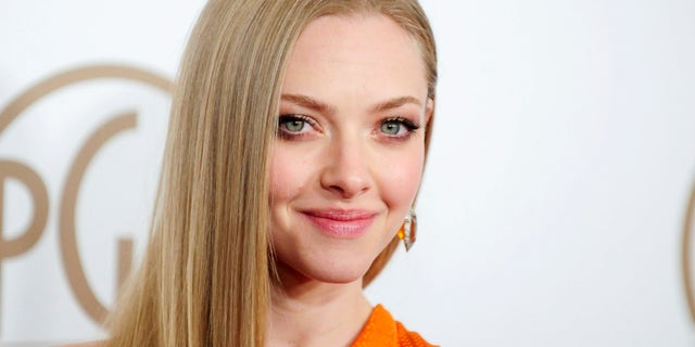 Actress Amanda Seyfried arrives at the Producers Guild of America Awards in Beverly Hills, California Jan. 26, 2013.