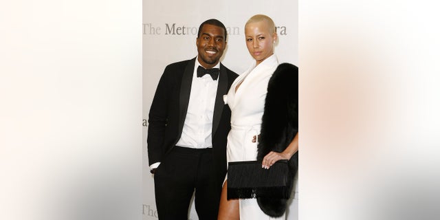 Musician Kanye West arrives with Amber Rose to attend the 125th Anniversary gala of the Metropolitan Opera in New York March 15, 2009. REUTERS/Lucas Jackson (UNITED STATES ENTERTAINMENT) - RTXCTWT