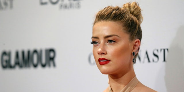 Actor Amber Heard poses at the Glamour Women of the Year Awards in Los Angeles, California, U.S., November 14, 2016. REUTERS/Mario Anzuoni - RTX2TP4P
