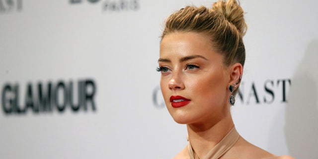 Actor Amber Heard poses at the Glamour Women of the Year Awards in Los Angeles, California, U.S., November 14, 2016. REUTERS/Mario Anzuoni - RTX2TP4P