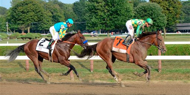 Aug. 29, 2015: Keen Ice , right, with Javier Castellano, right, slows after winning the Travers Stakes ahead of American Pharoah, with jockey Victor Espinoza, at Saratoga Race Course in Saratoga Springs, N.Y.