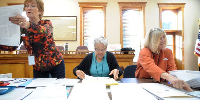 Election officials help voters at the Idaho Springs Courthouse in Idaho Springs, Colo. (AP)