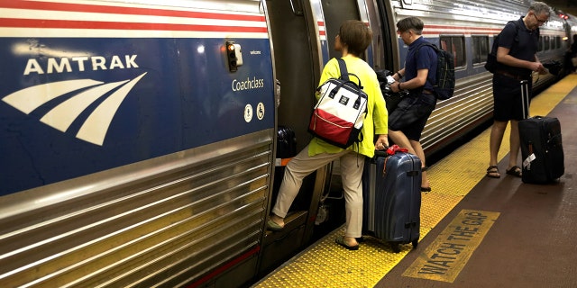 Amtrak riders board a train at Penn Station in New York City in an undated photo.
