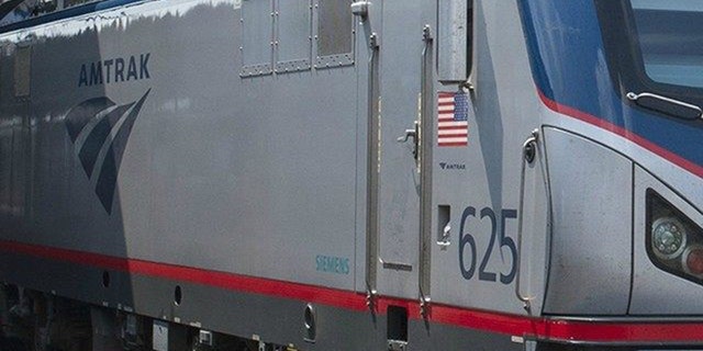 An Amtrak locomotive is shown.
