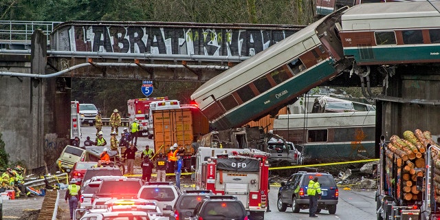Dec. 18, 2017: Cars from an Amtrak train that derailed lie spilled onto Interstate 5 in DuPont, Wash.