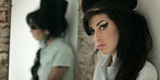 British singer Amy Winehouse wearing a beehive hairdo