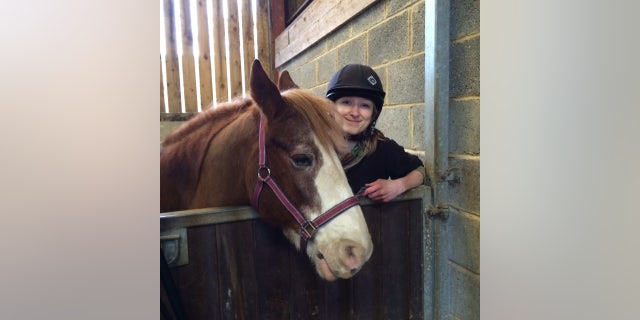University of Sussex researcher Amy Smith with one of the horses from the study. (University of Sussex)