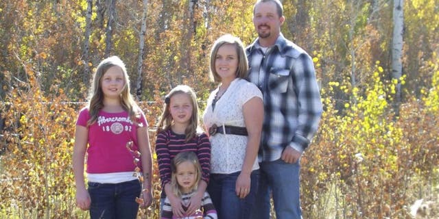 Andy Johnson, of Fort Bridger, Wy., is pictured in an undated photo with his wife and daughters.