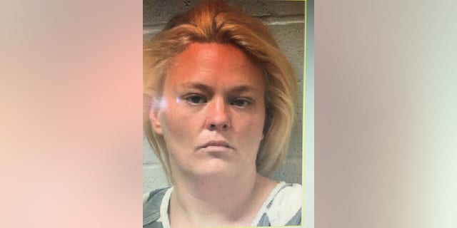 Angela Rainbolt is accused of harboring her fugitive brother, Brian Moody