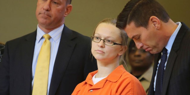 Angelika Graswald standing in court with her attorneys Jeffrey Chartier, left, and Richard Portale, right.