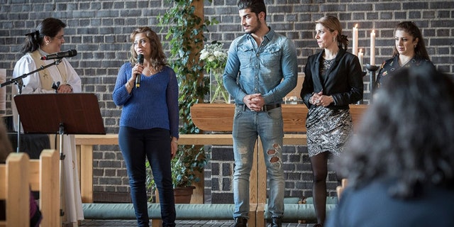 Annahita Parsan, at left, has converted hundreds to Christianity in Europe.