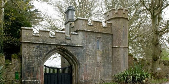 The Gothic-style castle is nestled on a quiet country road.