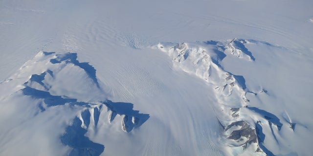 A new NASA study says that Antarctica is overall accumulating ice. Still, areas of the continent, like the Antarctic Peninsula photographed above, have increased their mass loss in the last decades. (NASA's Operation IceBridge)