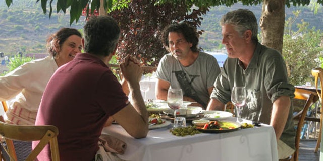 Bourdain traveled all over the world on his culinary adventures on "Parts Unknown." He's pictured here on a trip to Israel.