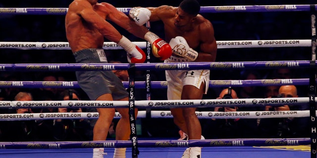 Britain Boxing - Anthony Joshua v Wladimir Klitschko IBF, IBO & WBA Super World Heavyweight Title's - Wembley Stadium, London, England - 29/4/17 Anthony Joshua in action with Wladimir Klitschko Action Images via Reuters / Peter Cziborra Livepic EDITORIAL USE ONLY. - 14786836