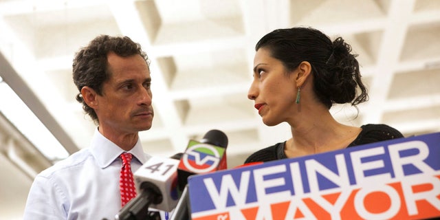 FILE - New York mayoral candidate Anthony Weiner and his wife Huma Abedin attend a news conference in New York, July 23, 2013.