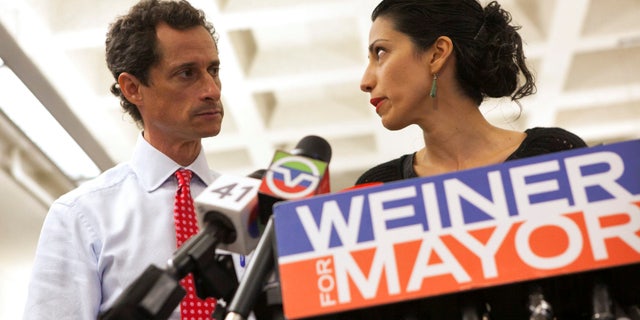 FILE - New York mayoral candidate Anthony Weiner and his wife Huma Abedin attend a news conference in New York, July 23, 2013.
