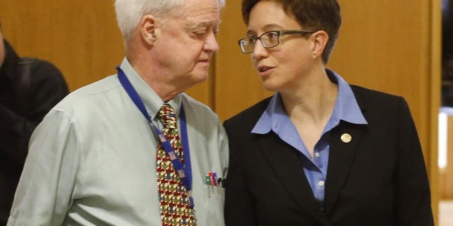 In this Feb. 13, 2015, file photo, Oregon Senate President Peter Courtney, left, and Speaker of the House Tina Kotek confer at the Capitol in Salem, Ore. The two fellow Democrats are being accused of covering up a pervasive culture of sexual harassment at the state capitol.