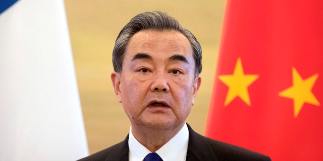 Chinese Foreign Minister Wang Yi speaks during a joint press conference with his French counterpart Jean-Marc Ayrault at the Ministry of Foreign Affairs in Beijing, Friday, April 14, 2017. (AP Photo/Mark Schiefelbein)