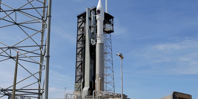 A United Launch Alliance Atlas V rocket that will carry supplies to the International Space Station stands ready at complex 41 at the Cape Canaveral Air Force Station, Monday, April 17, 2017, in Cape Canaveral, Fla. The launch is scheduled for Tuesday morning and for the first time, NASA cameras will provide live 360-degree video of the rocket heading toward space. (AP Photo/John Raoux)