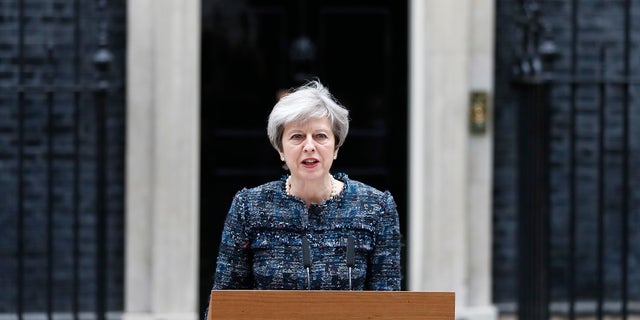 British Prime Minister Theresa May speaks to the media outside 10 Downing Street after returning from visiting Queen Elizabeth II at Buckingham Palace, in London where she asked for the dissolution of Parliament ahead of the upcoming general election, Wednesday, May 3, 2017. (AP Photo/Kirsty Wigglesworth)