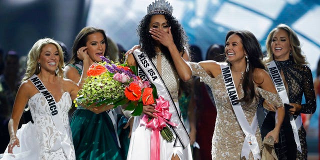 Miss District of Columbia USA Kara McCullough reacts after she was crowned the new Miss USA during the Miss USA contest Sunday, May 14, 2017, in Las Vegas.